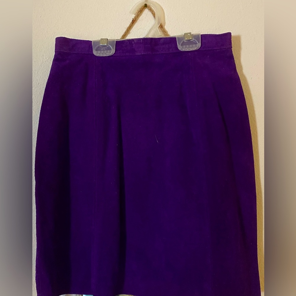 Deep purple suede skirt. Length is just above the knee.